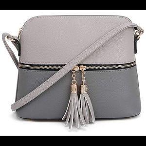 Light weight medium crossbody bag with tassel
